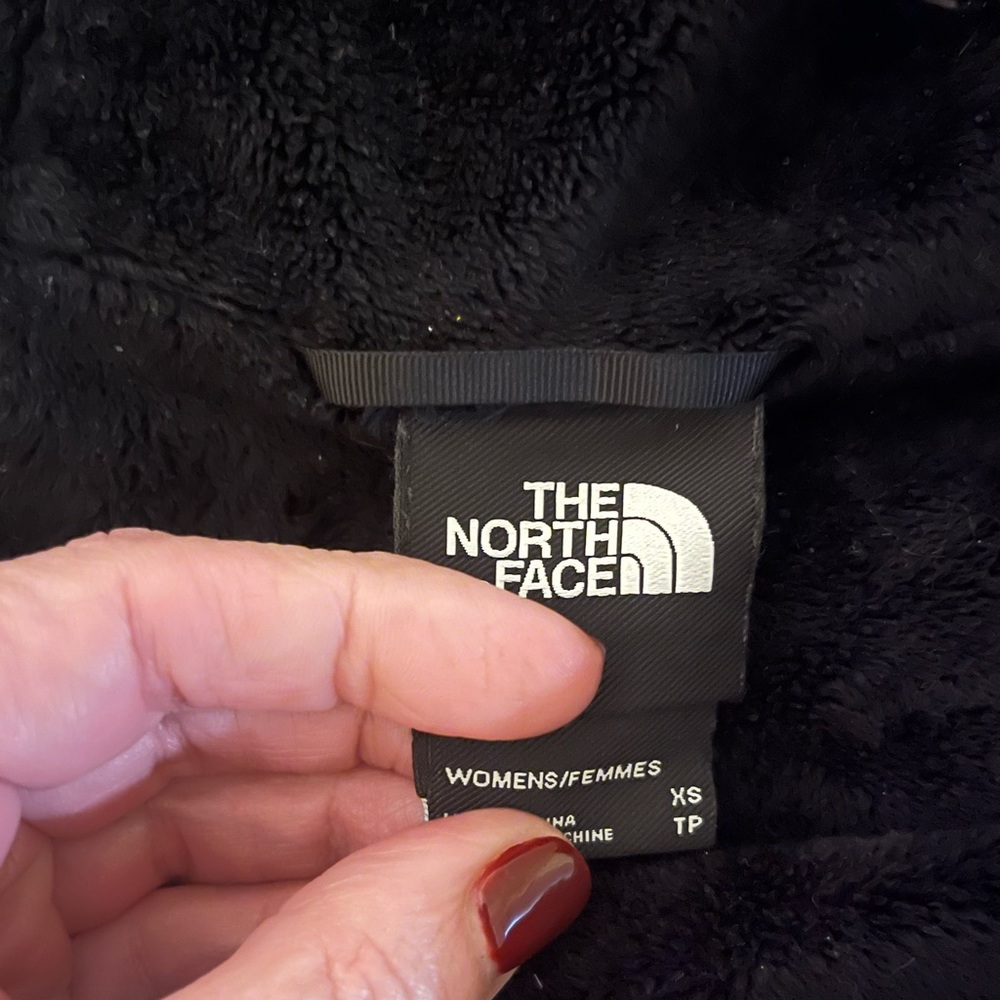 Black windblocking and water resistent with faux fur inside lining and hood